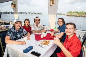 Type 1 Timer families enjoy a complimentary dinner cruise on the Naples Princess